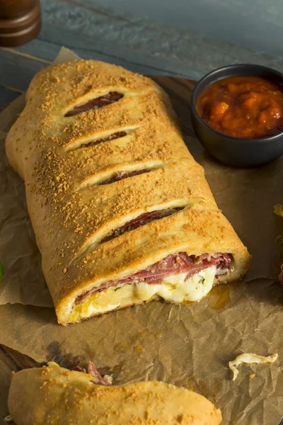 Homemade Cheesy and Meaty Italian Stromboli — Stock Photo, Image