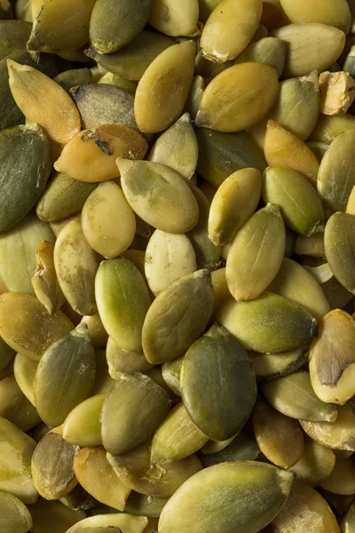 Pepitas de semente de abóbora orgânica verde cru — Fotografia de Stock