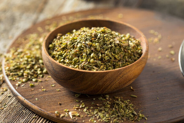 Raw Dried Green Greek Oregano Spice in a Bowl