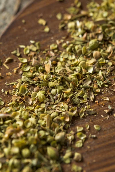 Raw Dried Green Greek Oregano Spice in a Bowl