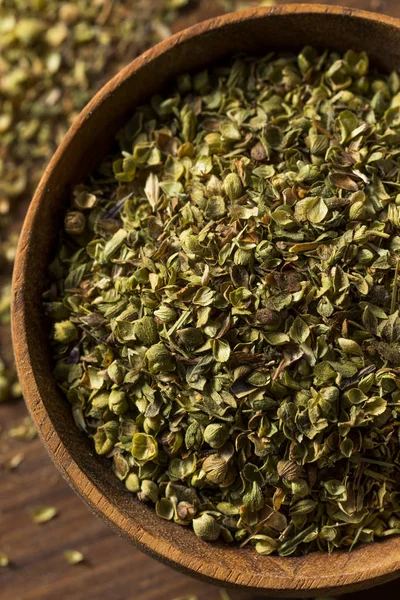 Raw Dried Green Greek Oregano Spice in a Bowl