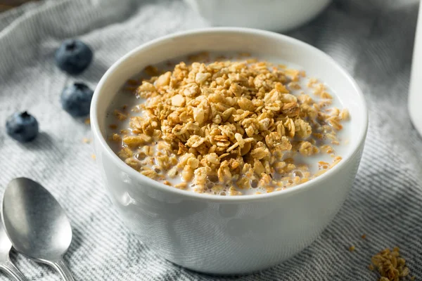 Healthy Organic Granola with Milk for Breakfast in a Bowl