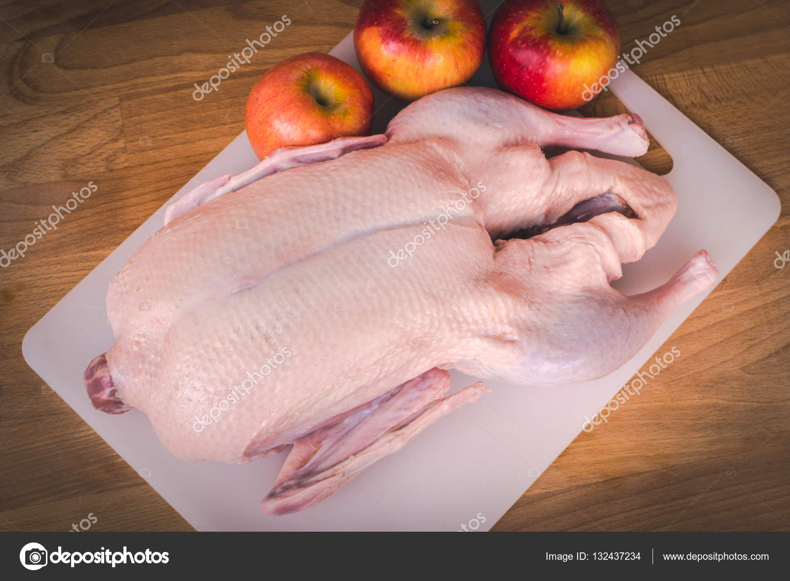 Raw duck carcass prepared for roasting. Whole raw duck ready to cook