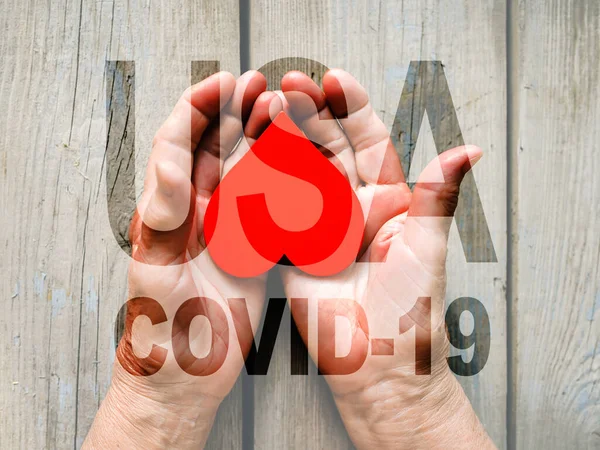 COVID-19 coronavirus. Fill text USA with old, young hands, red heart image cut. Elderly people health. Compassion, dangerous, volunteer, help, chinese virus outbreak, stop sign, stay at home.