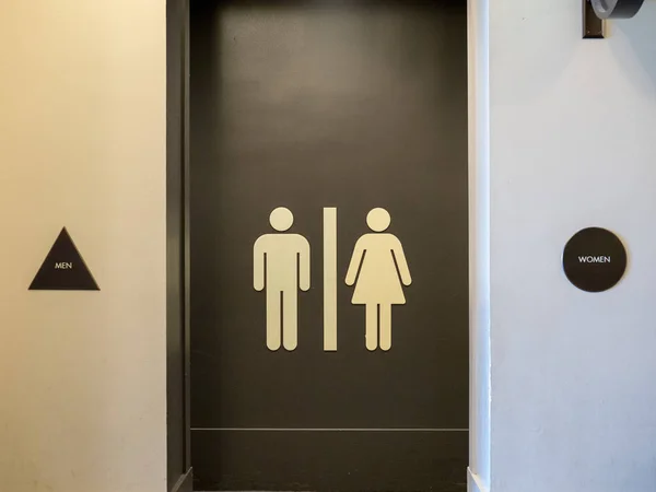 Männer und Frauen Toilettengang — Stockfoto