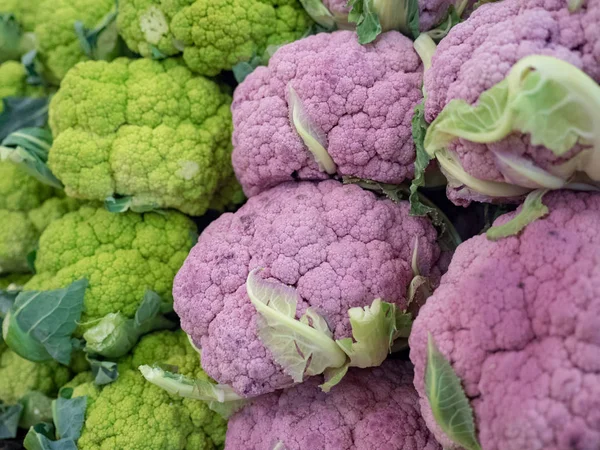 Purple and green cauliflower at market