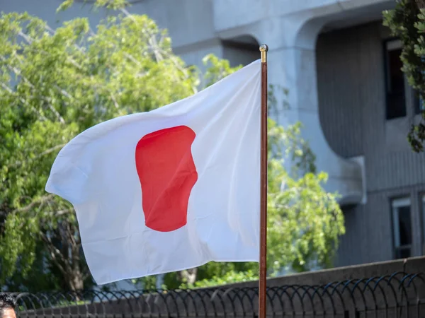 Japanese flag being waved outdoors — Stock Photo, Image