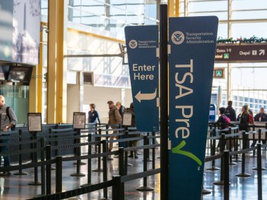 TSA precheck fast lane line before security at Reagan National Airport clipart