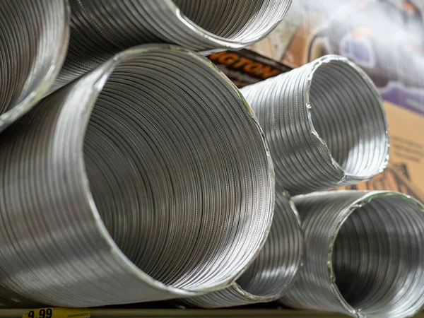 Aluminum duct sections piled high in store for purchase