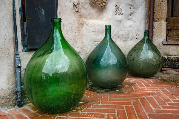 Huge empty old wine jars closeup. Tuscany
