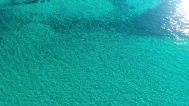 Aerial top down view from high altitude of blue azure turquoise sea water — Stock Video