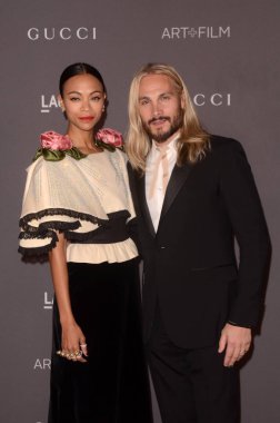 Sinema oyuncusu Zoe Saldana ve sanatçı Marco Perego