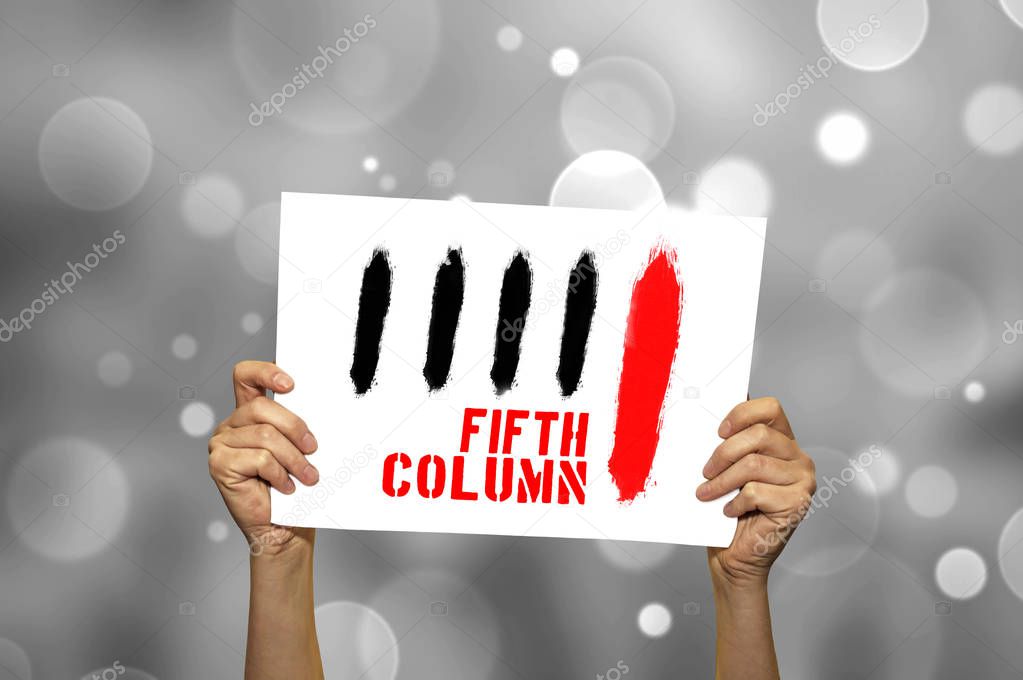 FIFTH COLUMN card in hand with abstract light background.