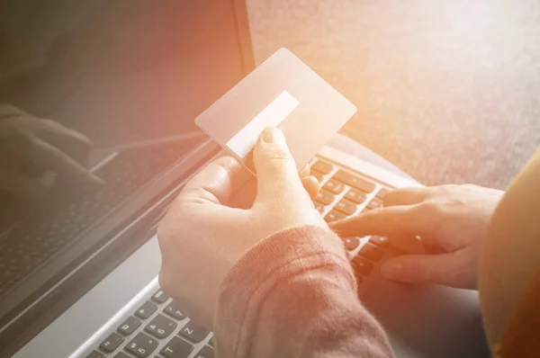 Woman holding credit card on laptop for online shopping concept. — Stock Photo, Image