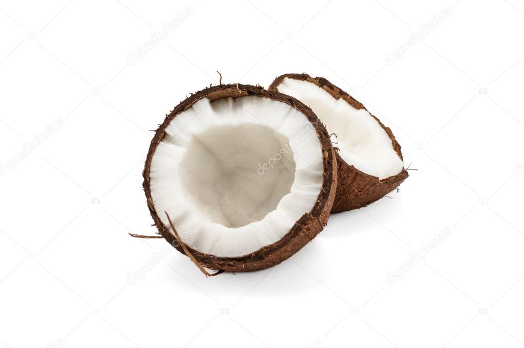 Two half of coconut isolated on white background with shadow.