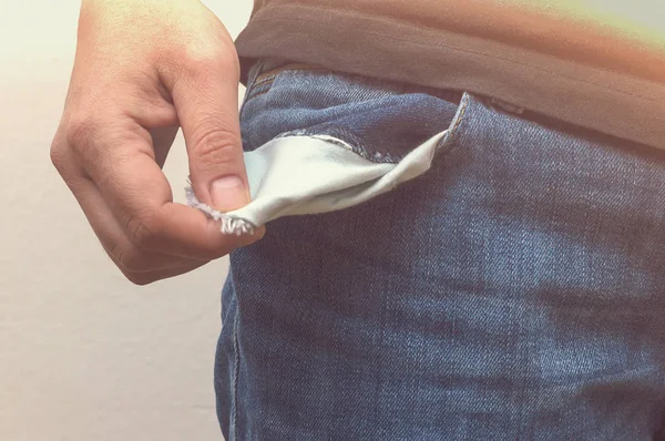 Close up of hand with empty pocket. No money in pocket. — Stock Photo, Image