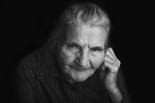 Portrait of a sad elderly woman. Dreaming the past. — Stock Photo, Image