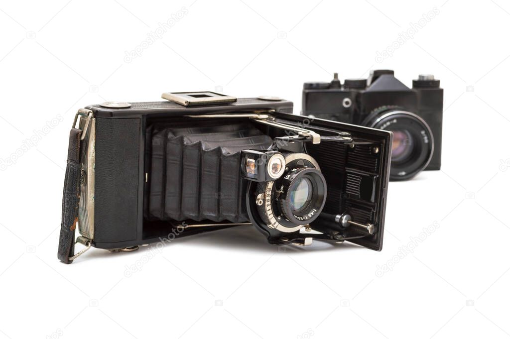 Two antique old photo camera isolated on white background. Selective focus