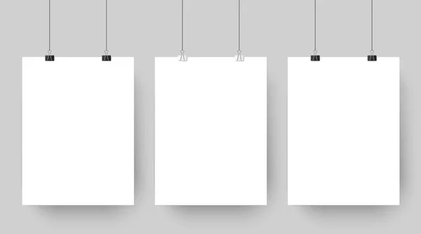 Un mockup vuoto appeso a delle graffette. Bianco modello di poster pubblicitario vuoto getta ombra su sfondo grigio vettoriale illustrazione — Vettoriale Stock