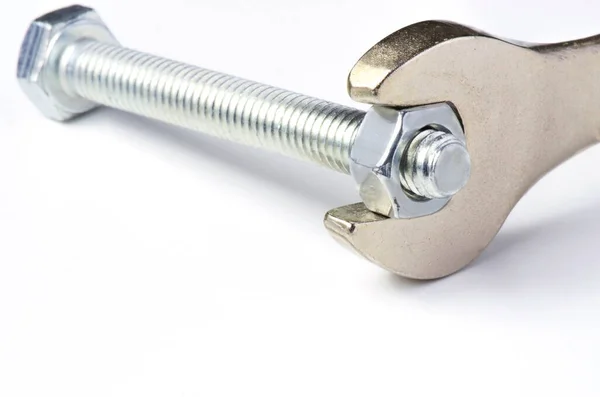Wrench Unscrews Nut Bolt White Background Copy Space — Stock Photo, Image