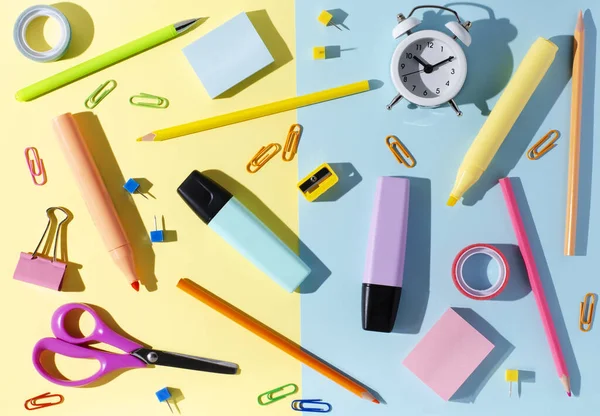 Children's accessories for study, creativity and office supplies on a colored paper background. Back to school concept.