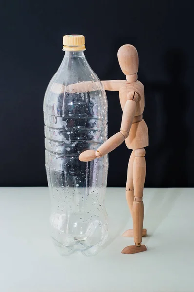 Plastic Bottle Water Wooden Mannequin Black Background — Stock Photo, Image