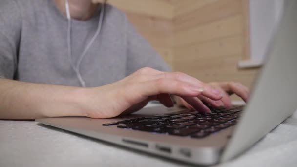 Woman typing a message on a laptop, working during isolation period at home HD footage — Stock Video