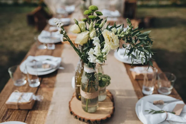 The composition of flowers and greenery Stock Image