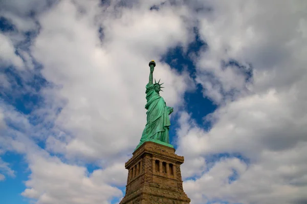 Statue of Liberty isolated on the blue sky with the white clouds on the sunny day , New York, USA. October ,2018. — Stock Photo, Image