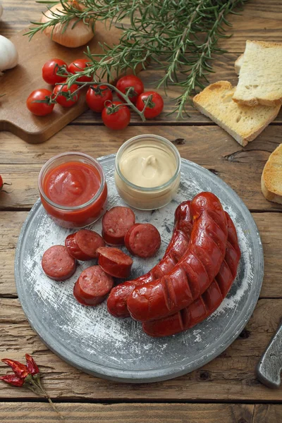 Grilled sausages with sauces — Stock Photo, Image