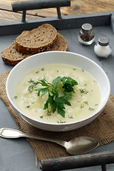 Vegetarian cream soup in a rustic pan — Stock Photo, Image