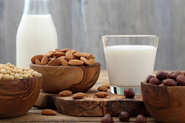 Coconut milk on rustic wooden table — Stock Photo, Image