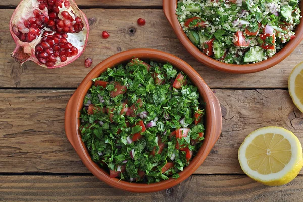 Tabbouleh in ceramic bowl on rustic table background — Stock Photo, Image