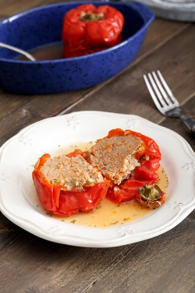Stuffed red peppers in plate — Stock Photo, Image