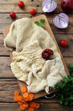 raw  tripe  on rustic kitchen table background