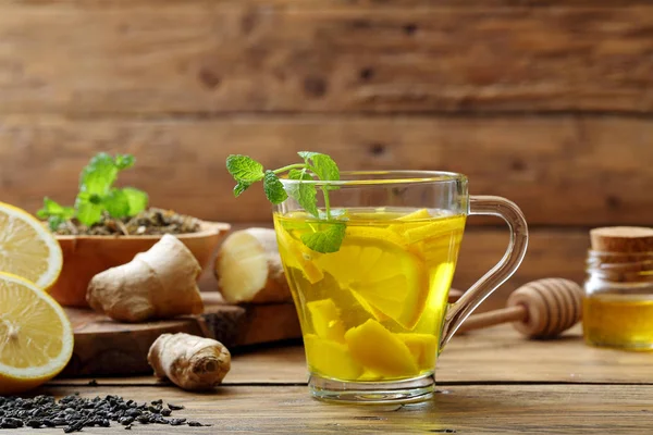 Cup of ginger tea with honey and lemon