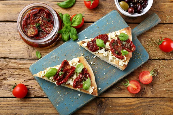 Mediterranean Food Tapas Pizza Dried Tomatoes Olives Anchovies Rustic Background — Stock Photo, Image