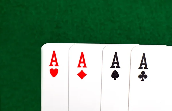 Four aces on green table. — Stock Photo, Image