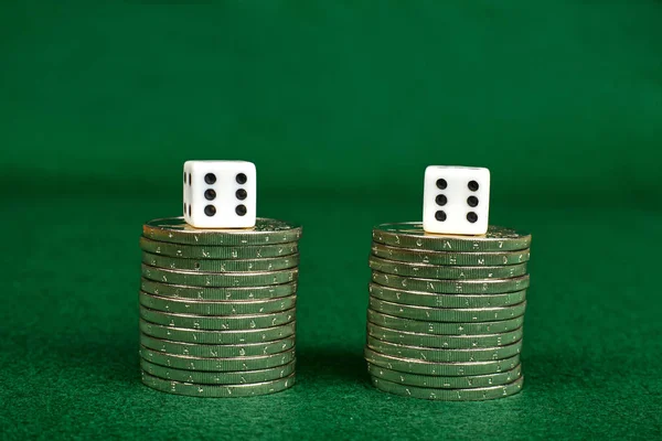 Coin stacks and two dices — Stock Photo, Image