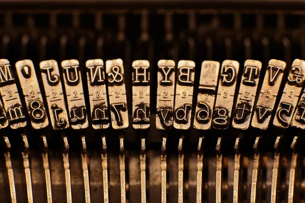 Old typewriter plates strikers with letters and symbols. — Stock Photo, Image