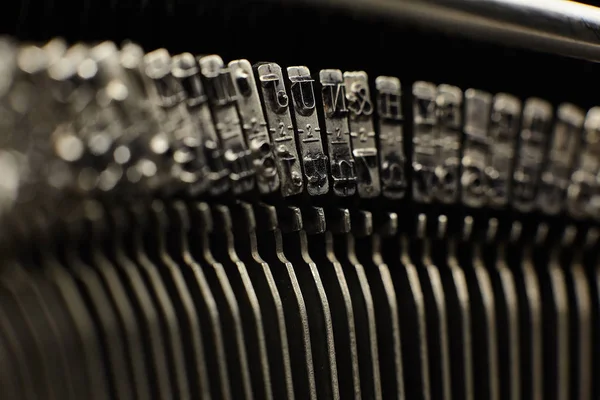 Old typewriter plates strikers with letters and symbols. — Stock Photo, Image