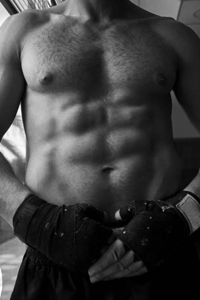 Closeup of an athletic kick boxer body.