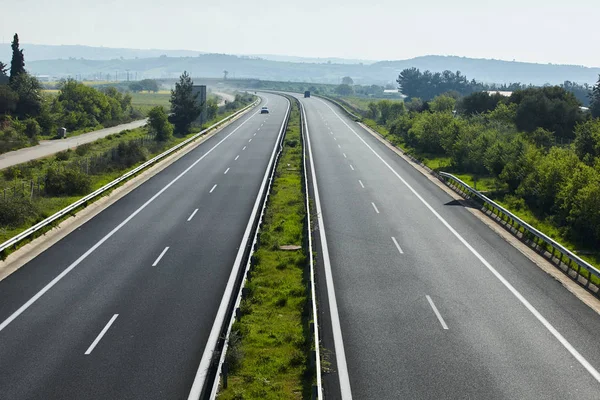 Highway traffic in sunset with cars and trucks — Stock Photo, Image