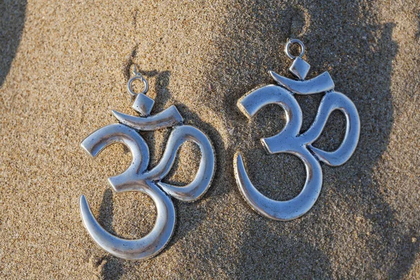 Silver earrings with om symbol