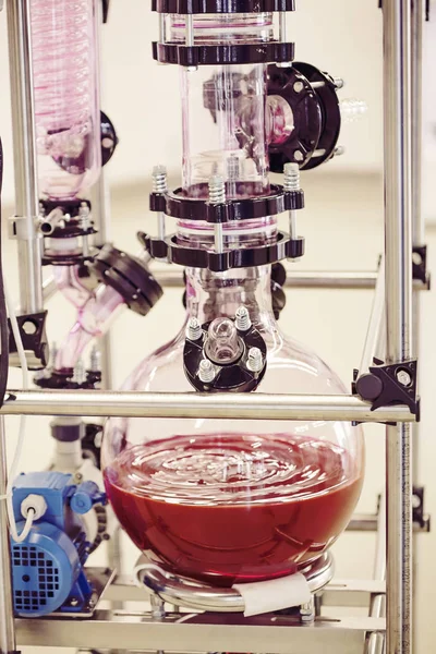 Laboratory chemical machine with moving red liquid