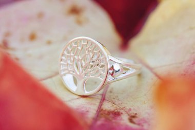 Sterling silver tree shape ring detail on natural Autumn background