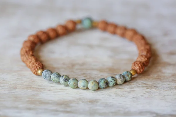 Natural Mineral Stone Beads Yoga Bracelet Natural Wooden Background — ストック写真