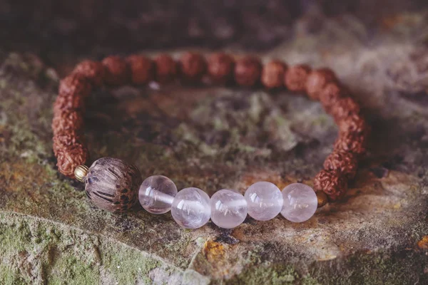 Mineral Stone Beads Natural Rudraksha Seed Beads Bracelet Rocky Background — Stockfoto