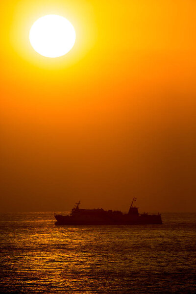 Passenger ship sailing in beautiful sunset in Japan
