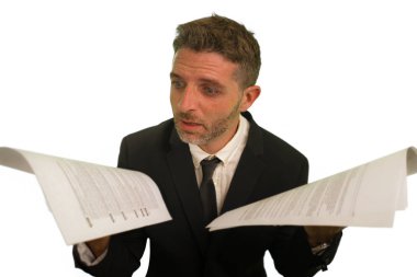 corporate company work lifestyle portrait of stressed and frustrated businessman holding paperwork reports overwhelmed and upset in business problems and stress